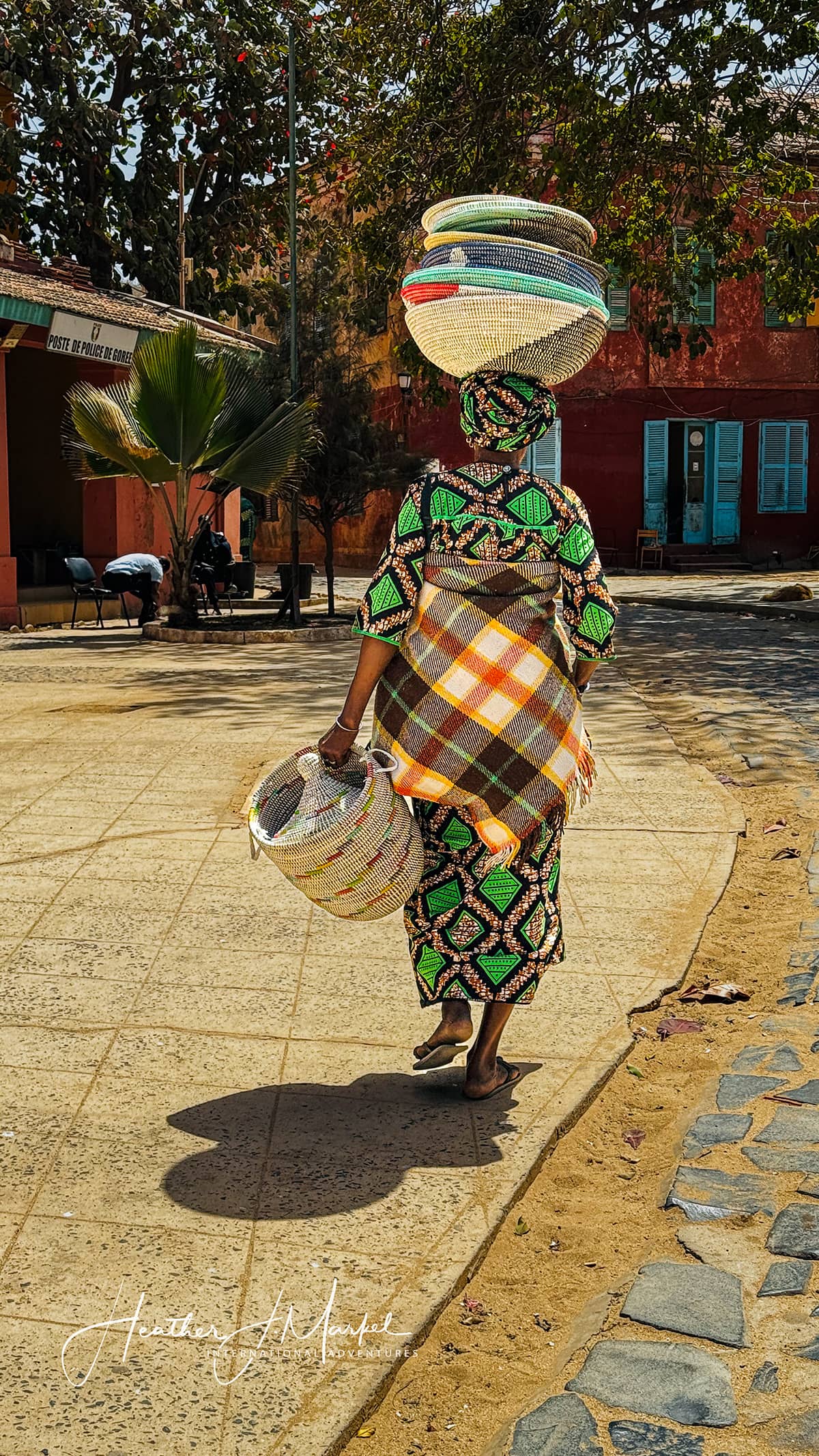 artisan using 7 colors of sand from Senegal